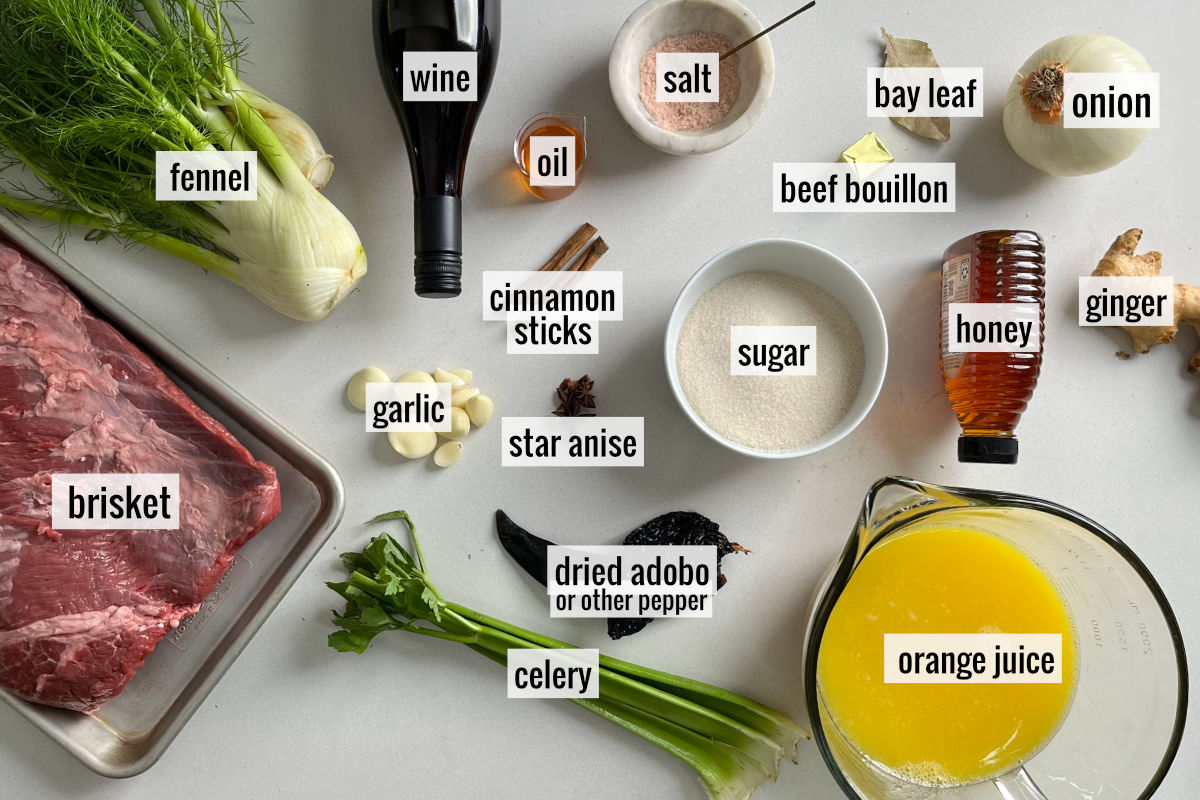 Brisket and other ingredients to braise it on a countertop.