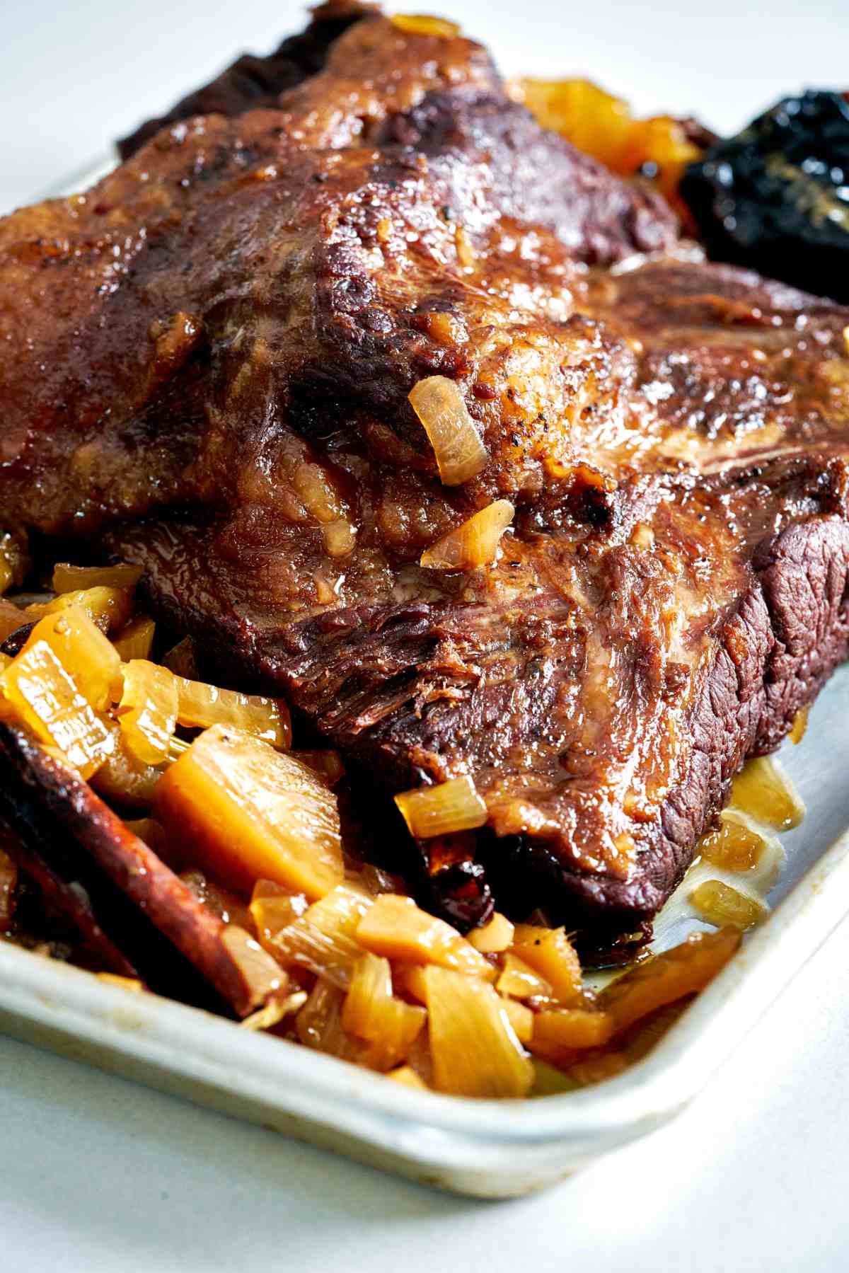 Brisket resting on a sheet pan.