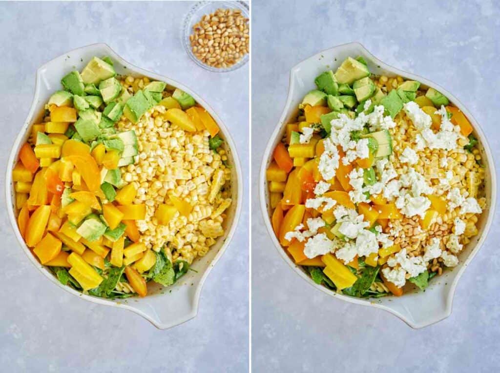 Mixing bowl full of beets, avocado, corn, pasta, and cheese.