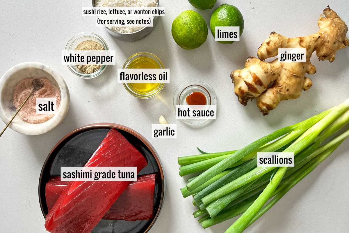 Tuna and other tartare vinaigrette ingredients on a countertop.