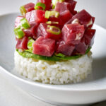 Tuna tartare on top of avocado and rice.