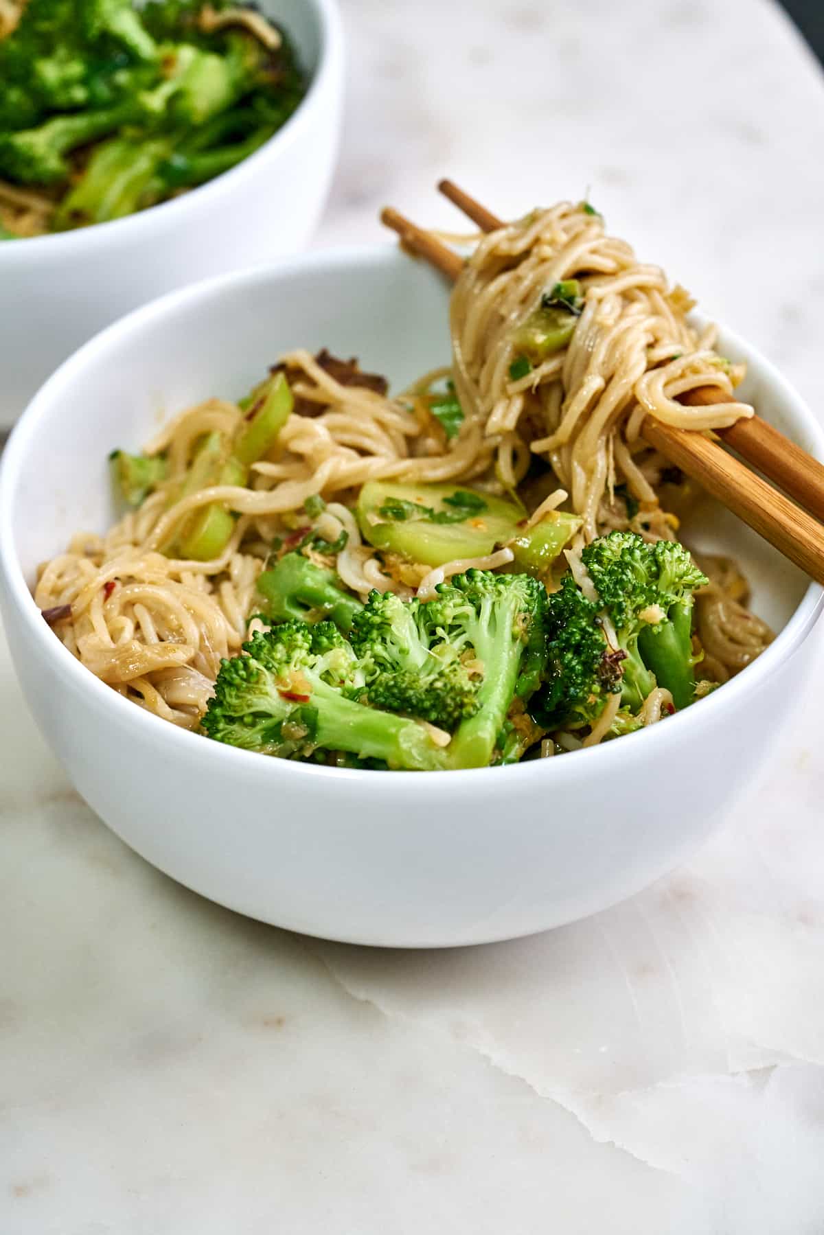 Noodles twirled on chopsticks.