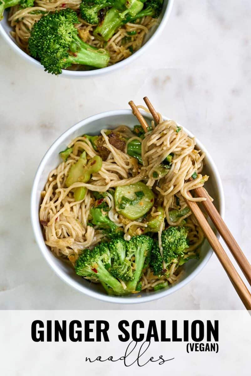 Bowl of noodles and broccoli with chopsticks.