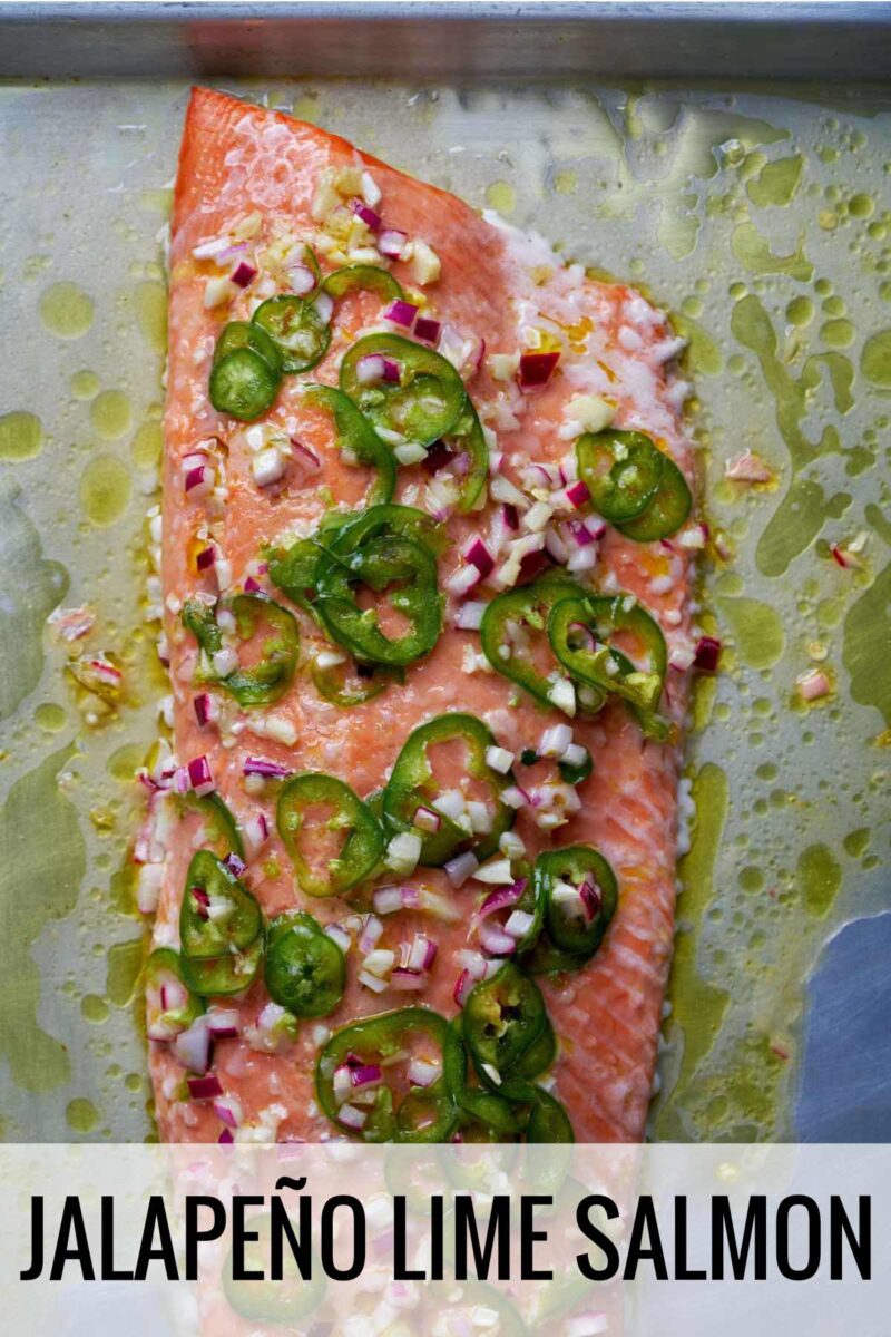 Cooked salmon on a baking dish with jalapeno slices and title text.