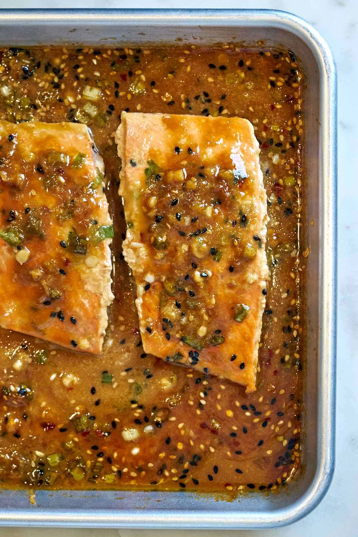 Cooked salmon on a baking sheet.