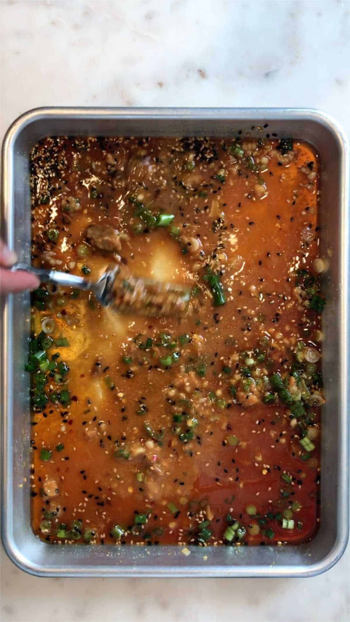 Marinade on a baking sheet.