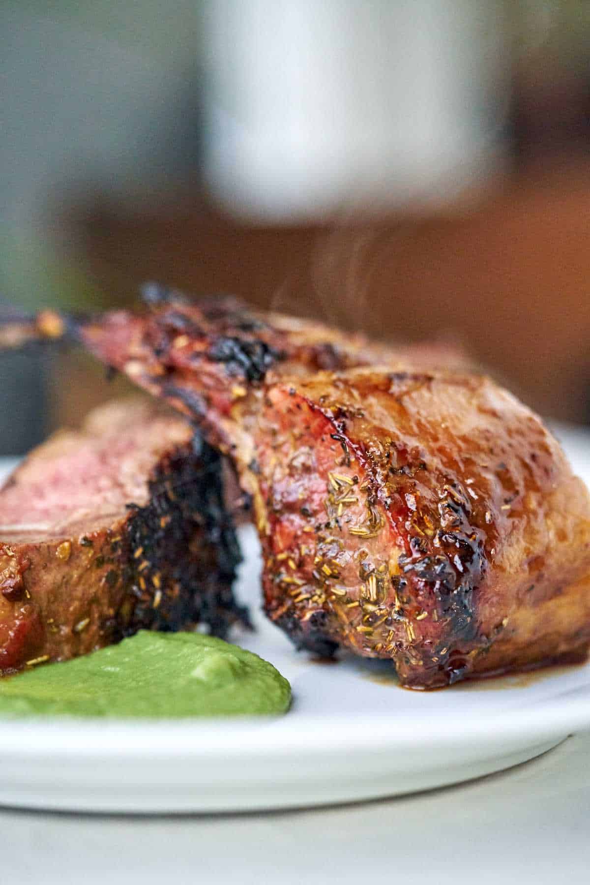 Rack of lamb chops on a plate.