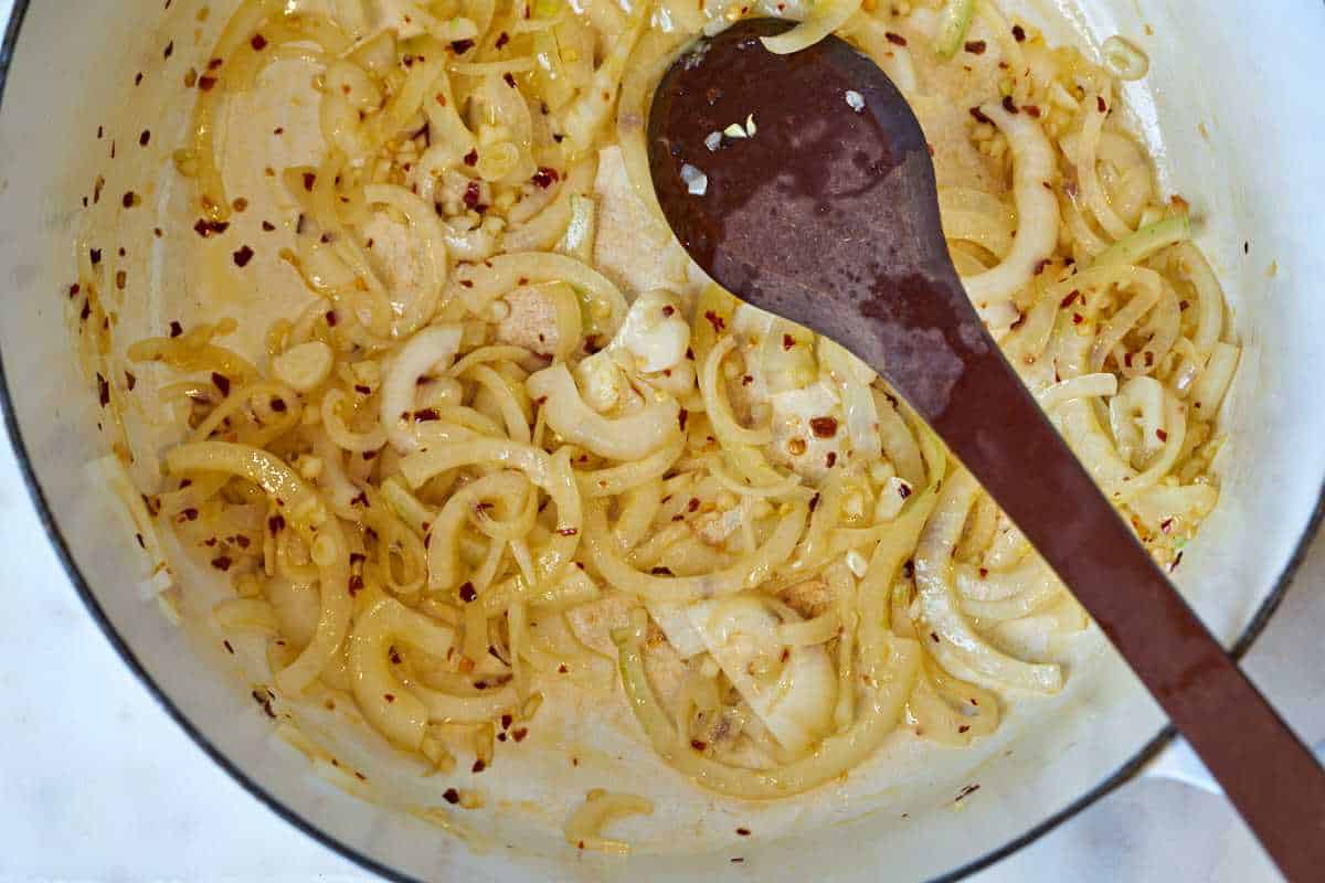 Onions cooking in a pot.