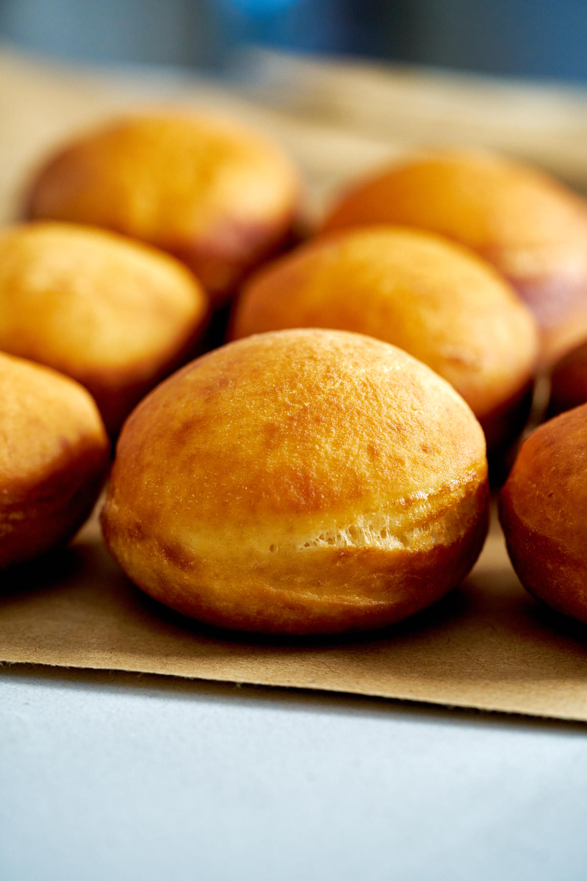 Fried donuts on a paper bag.