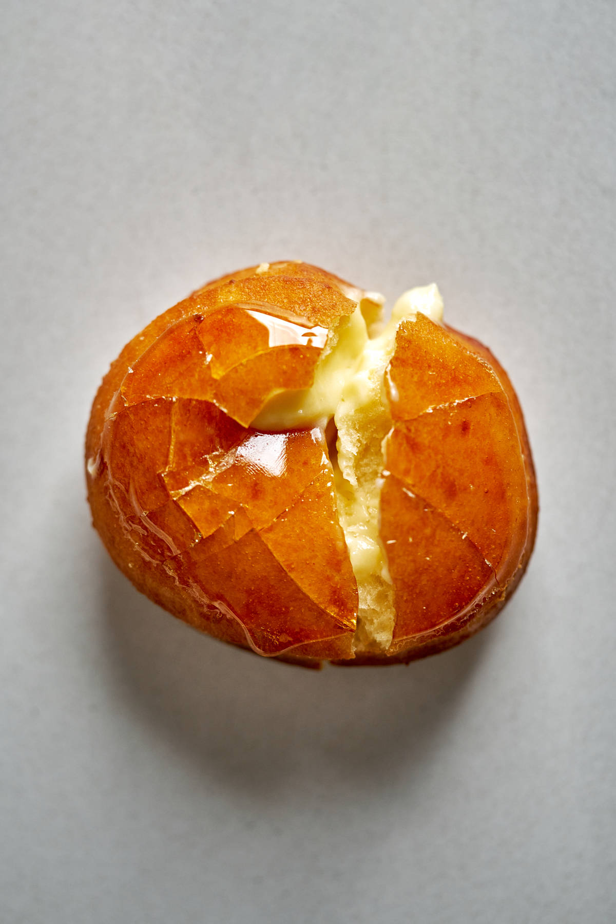 Filled donut with cracked caramel topping.