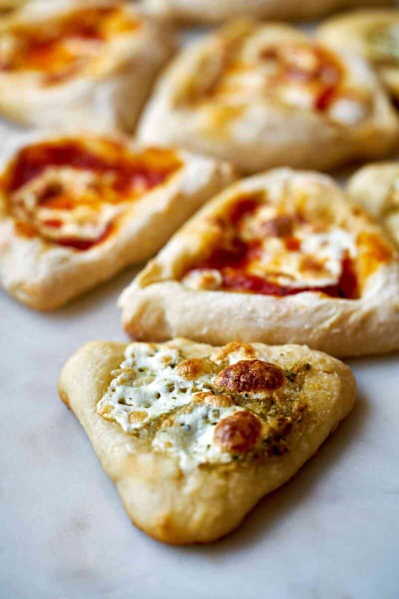 Mini triangular pizzas.