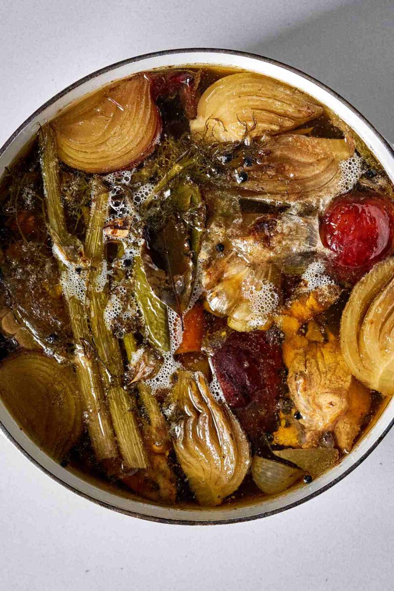 Top view of cooked stock in a stock pot.