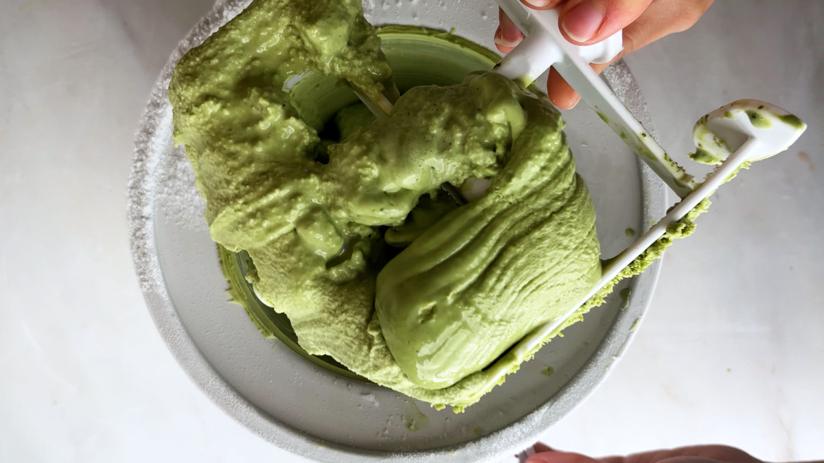 Green ice cream in an ice cream maker.