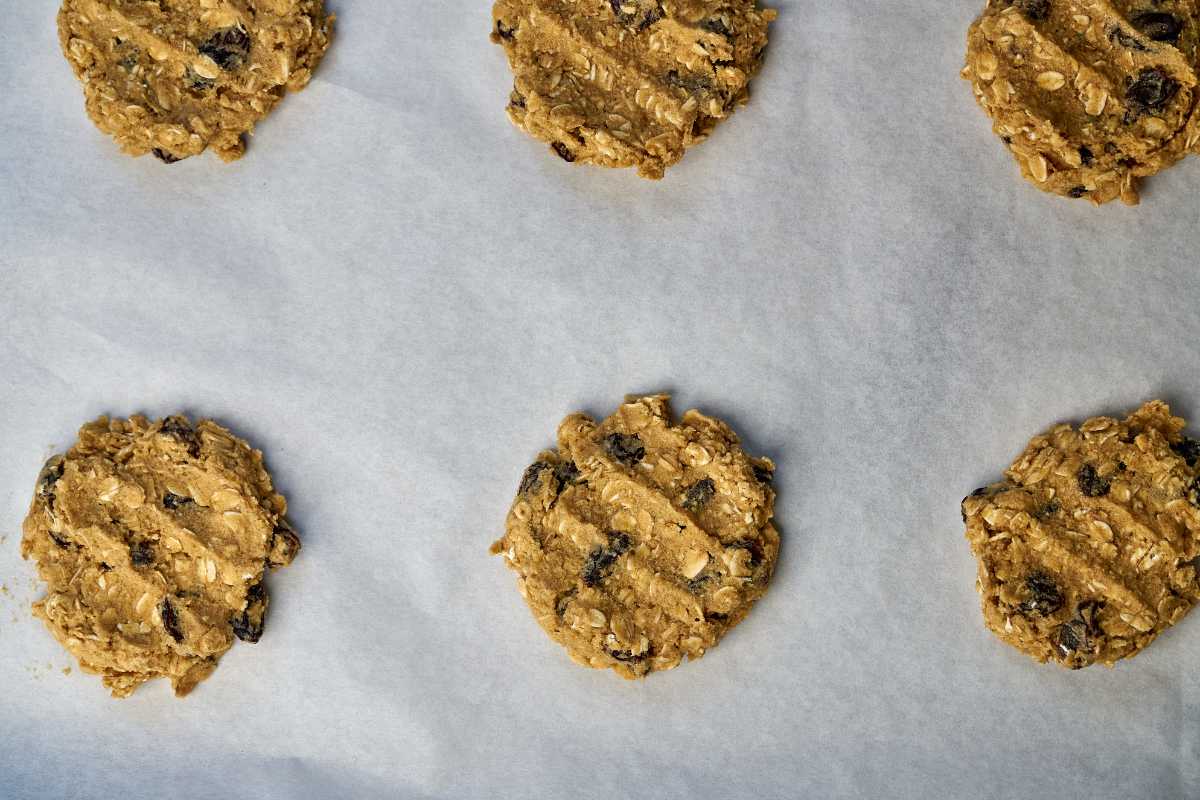 Pressed cookie dough on parchment paper.