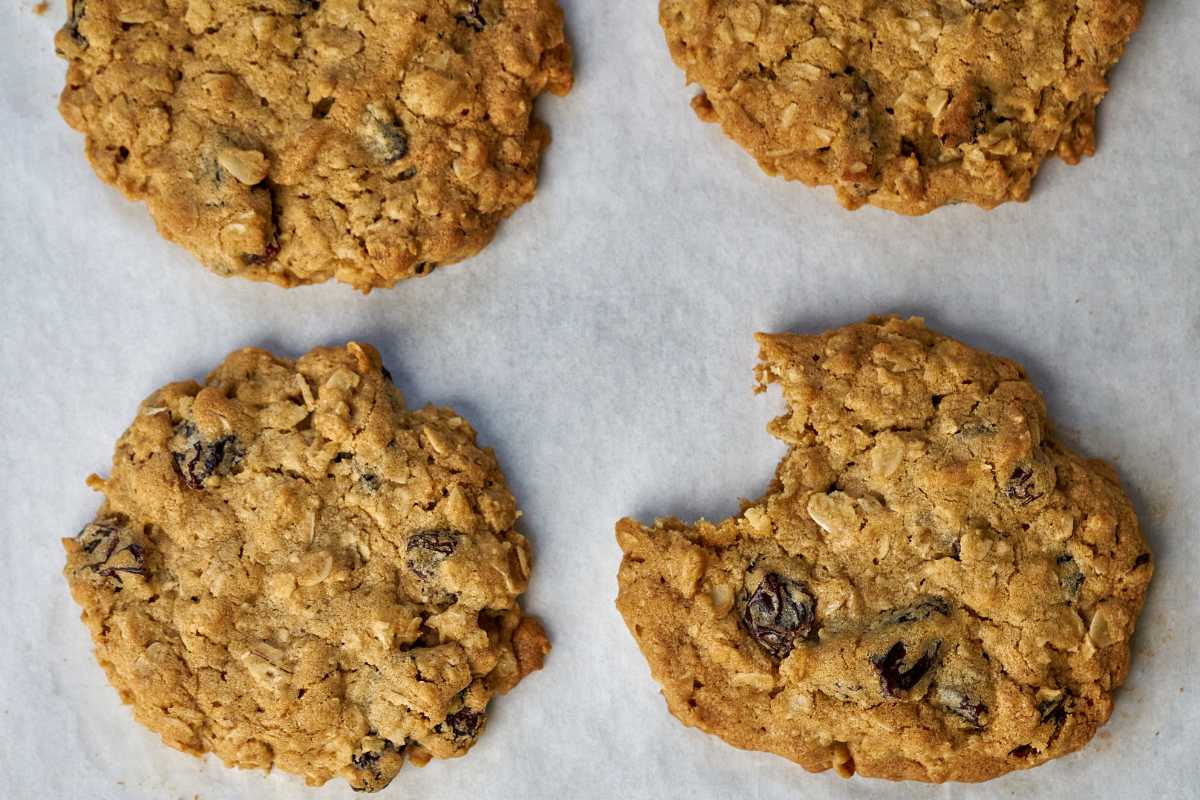 Four cookies on parchment paper.