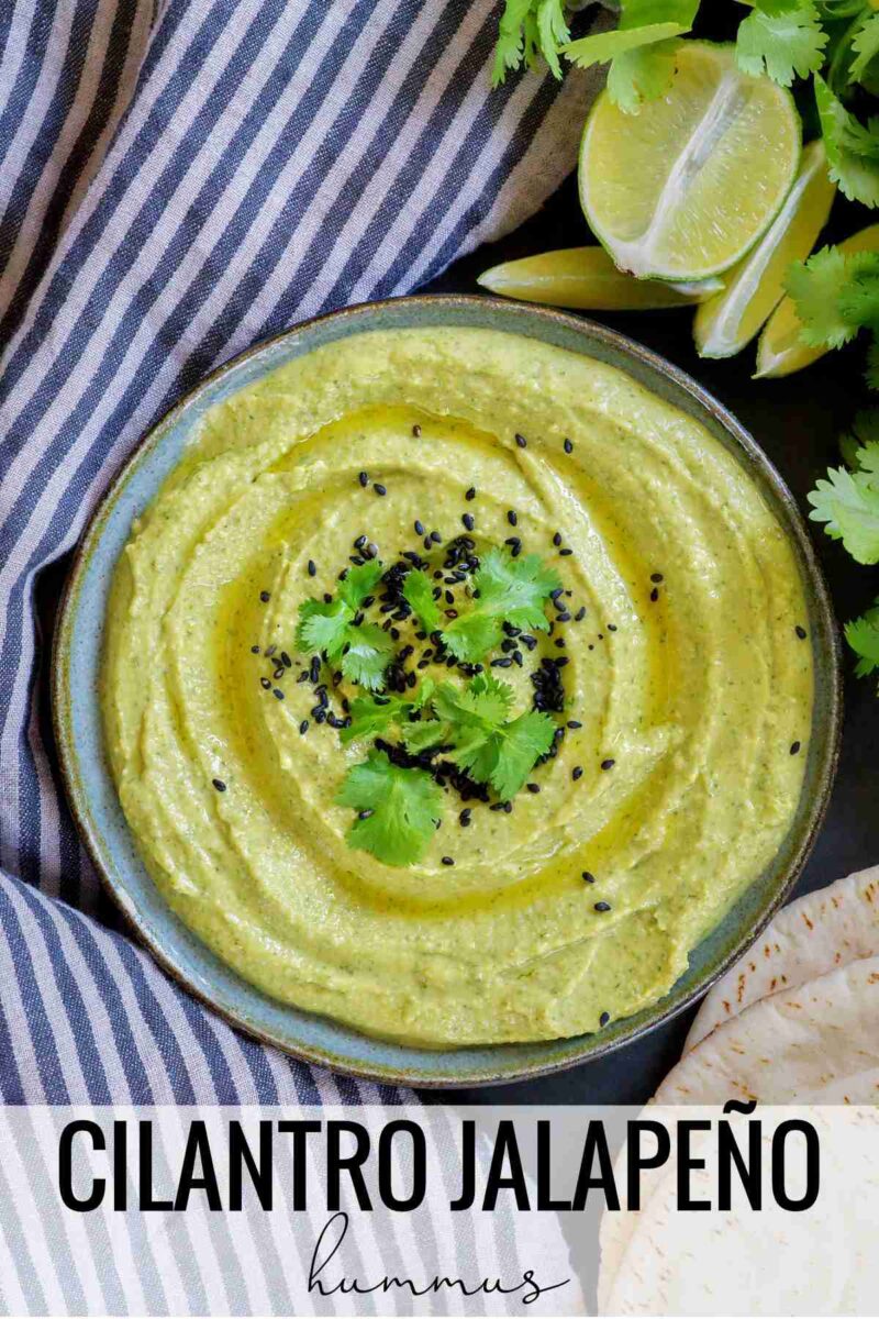 Plate of green hummus with title text.
