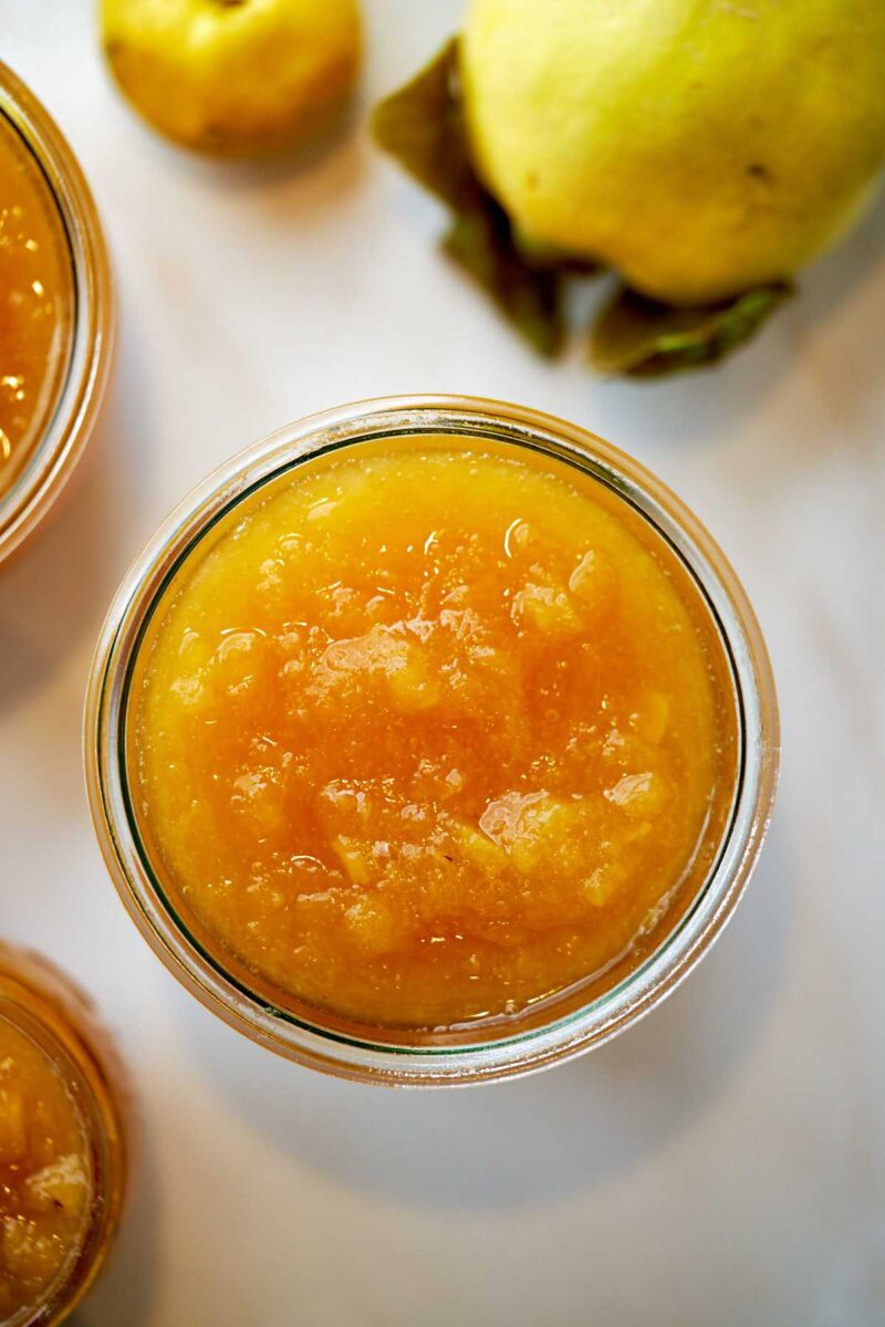 Top view of orange jam in a jar.