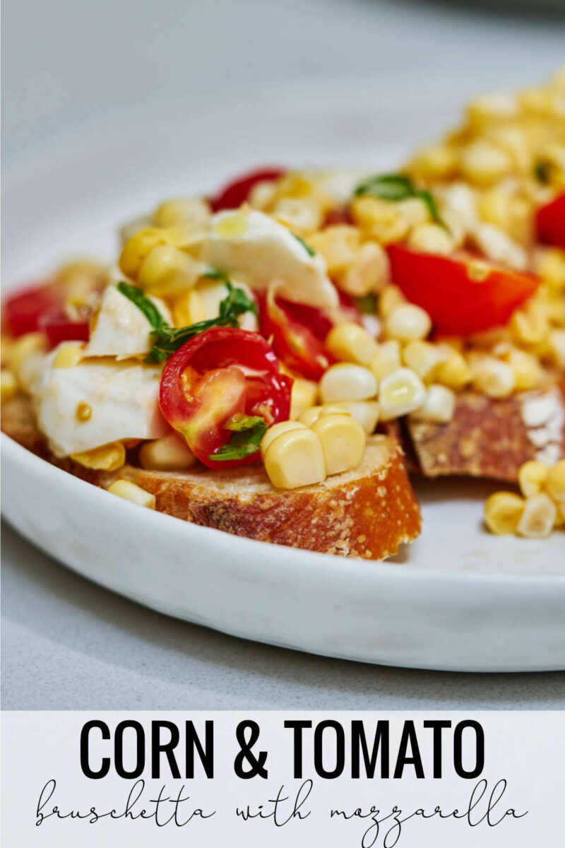 Corn and tomato salad on top of slices of baguette with title text.