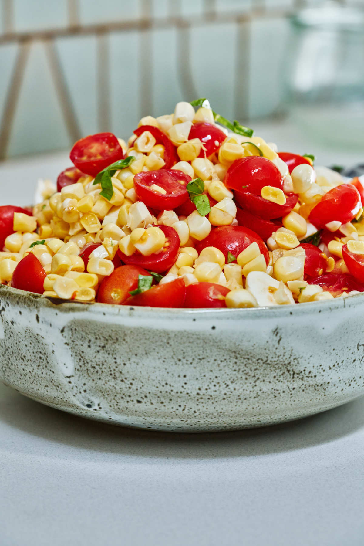 Bowl of corn and tomato salad.