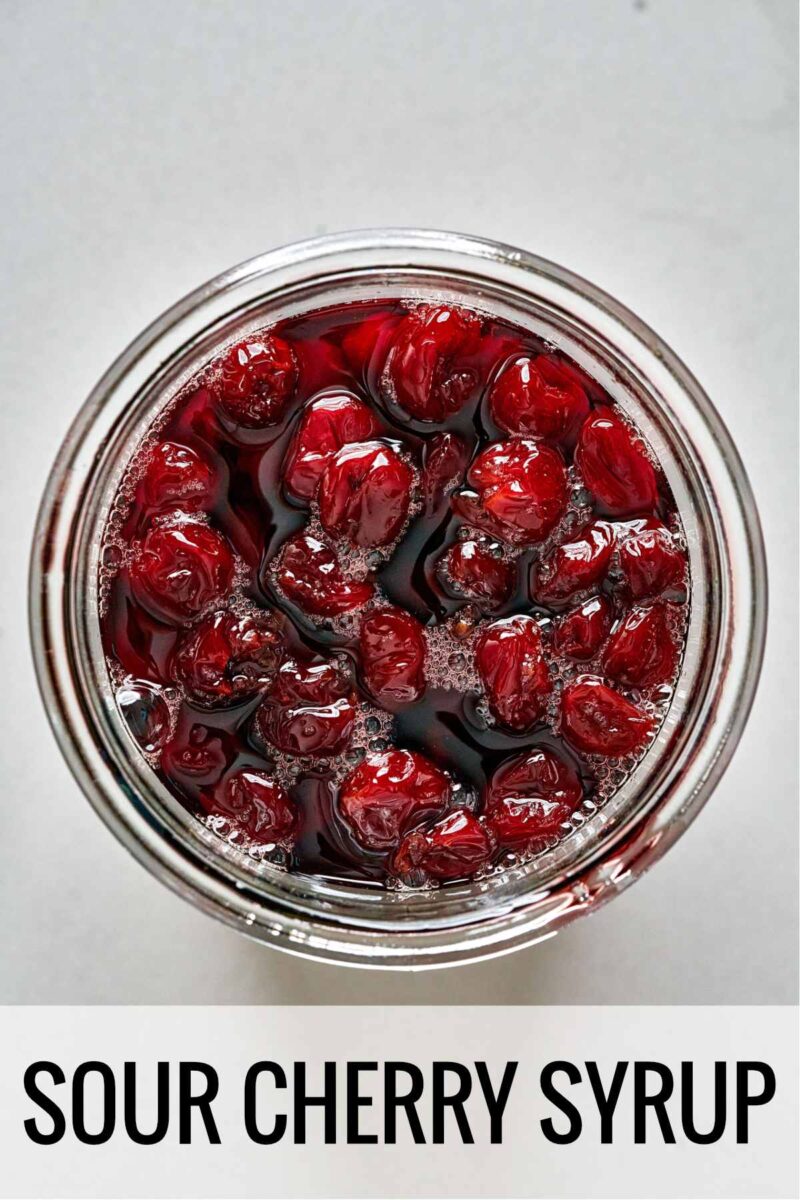 Top view of cooked sour cherries syrup with title text.