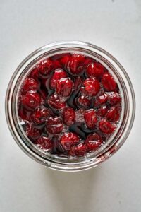 Top view of cooked sour cherries syrup.