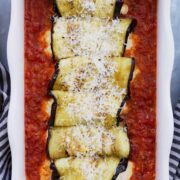 Rolled eggplants in red pasta sauce.