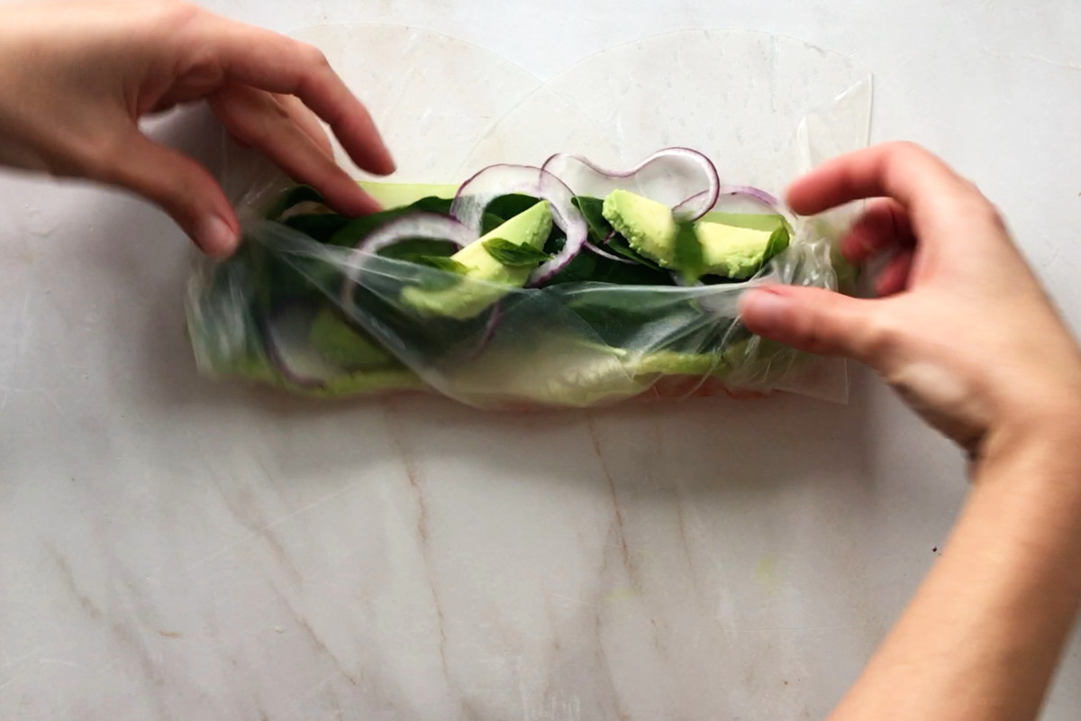 Rolling salad in rice paper.