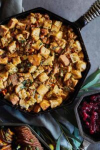 Cast iron pan with bread and sausage stuffing.