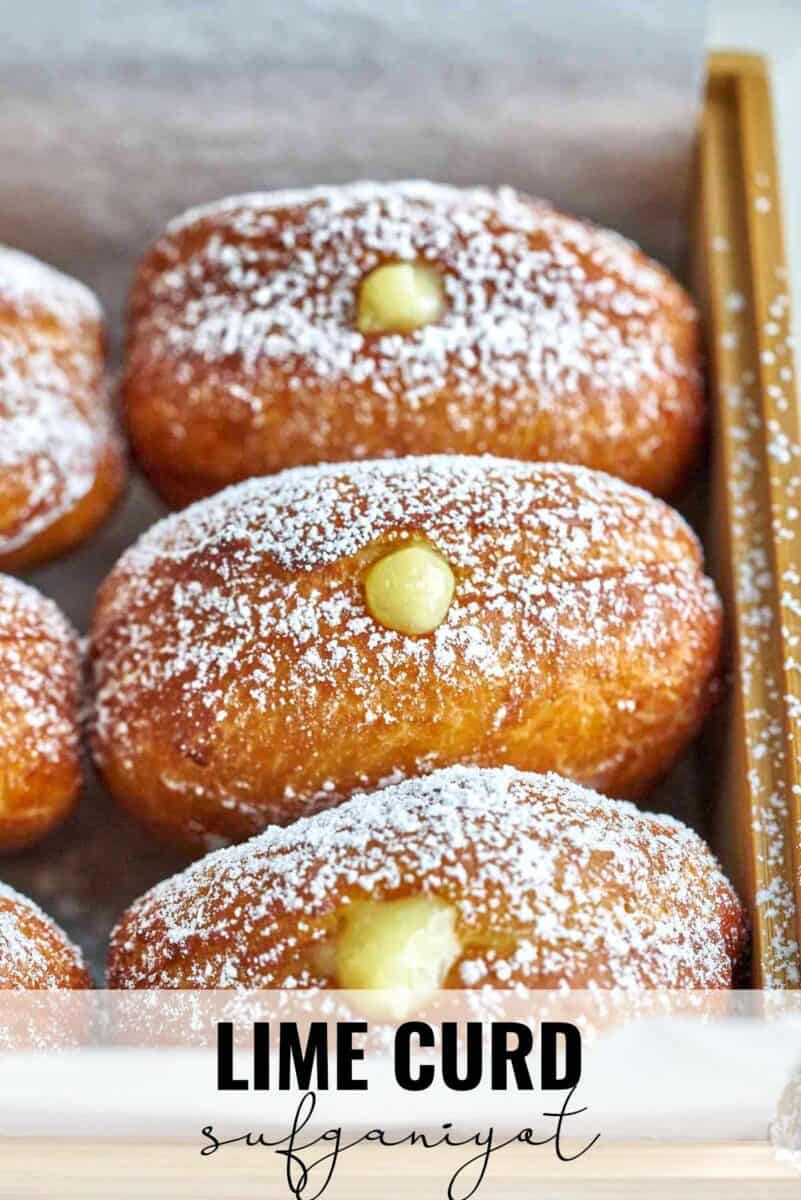 Filled donuts in a wood box.