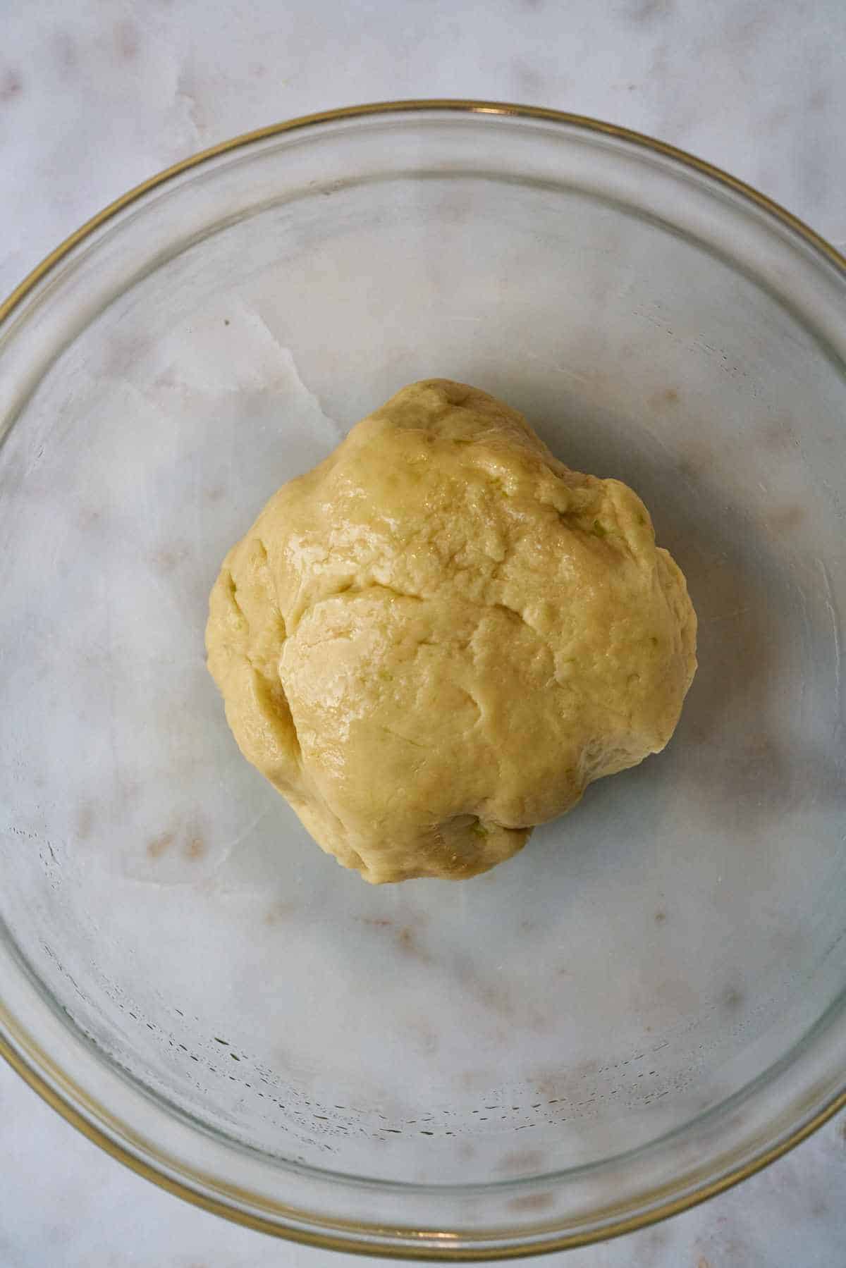 Ball of dough in a bowl.