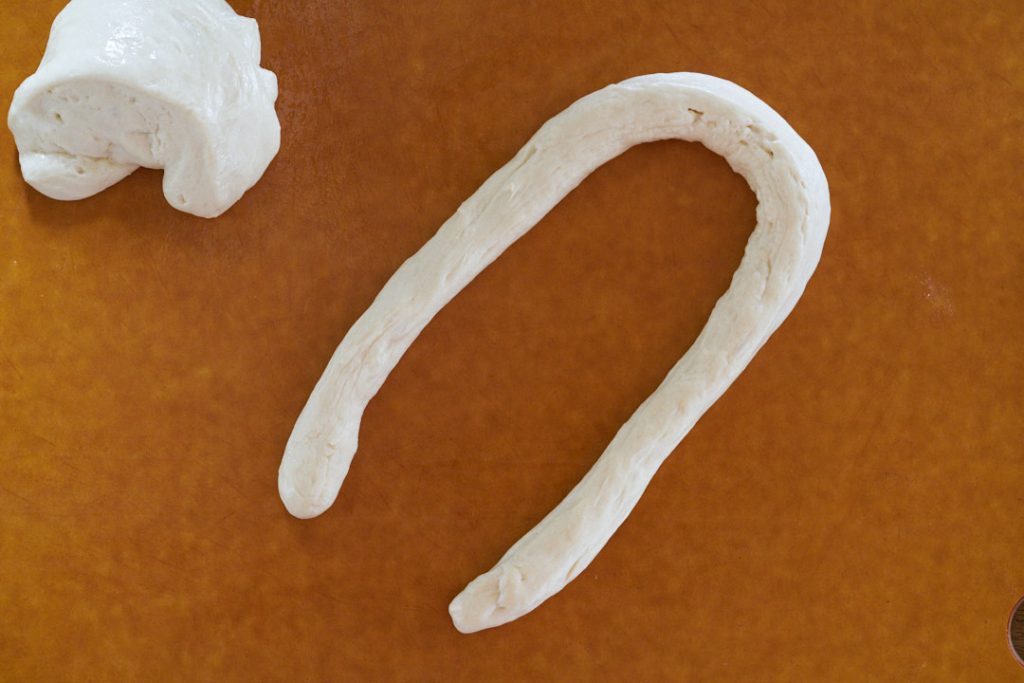 Dough formed in a U shape.