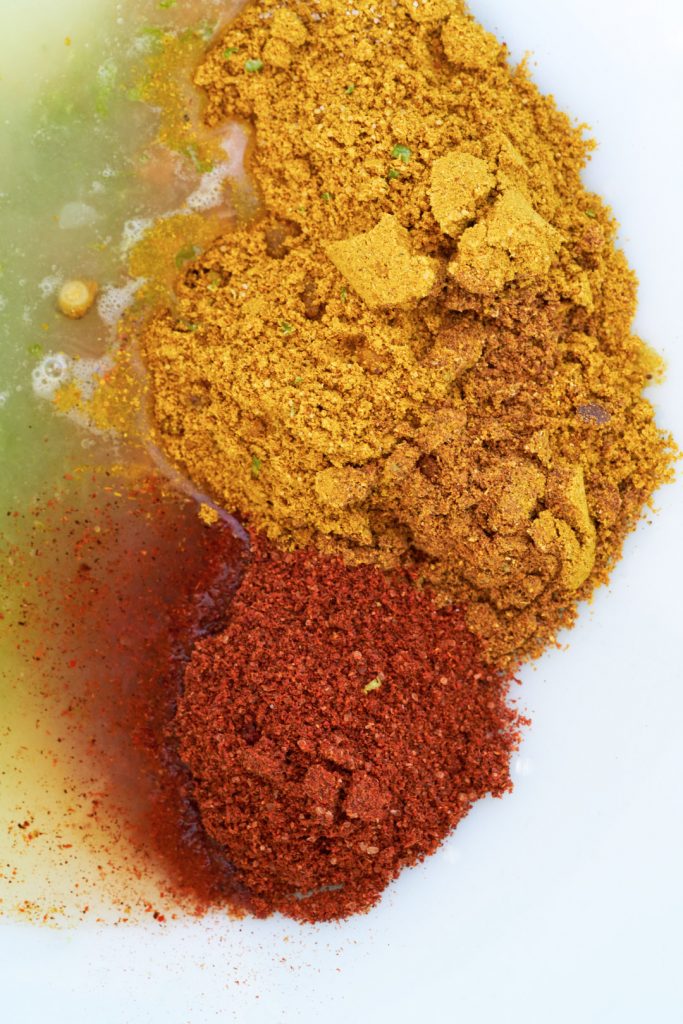 Curry spices in a bowl with lime juice.