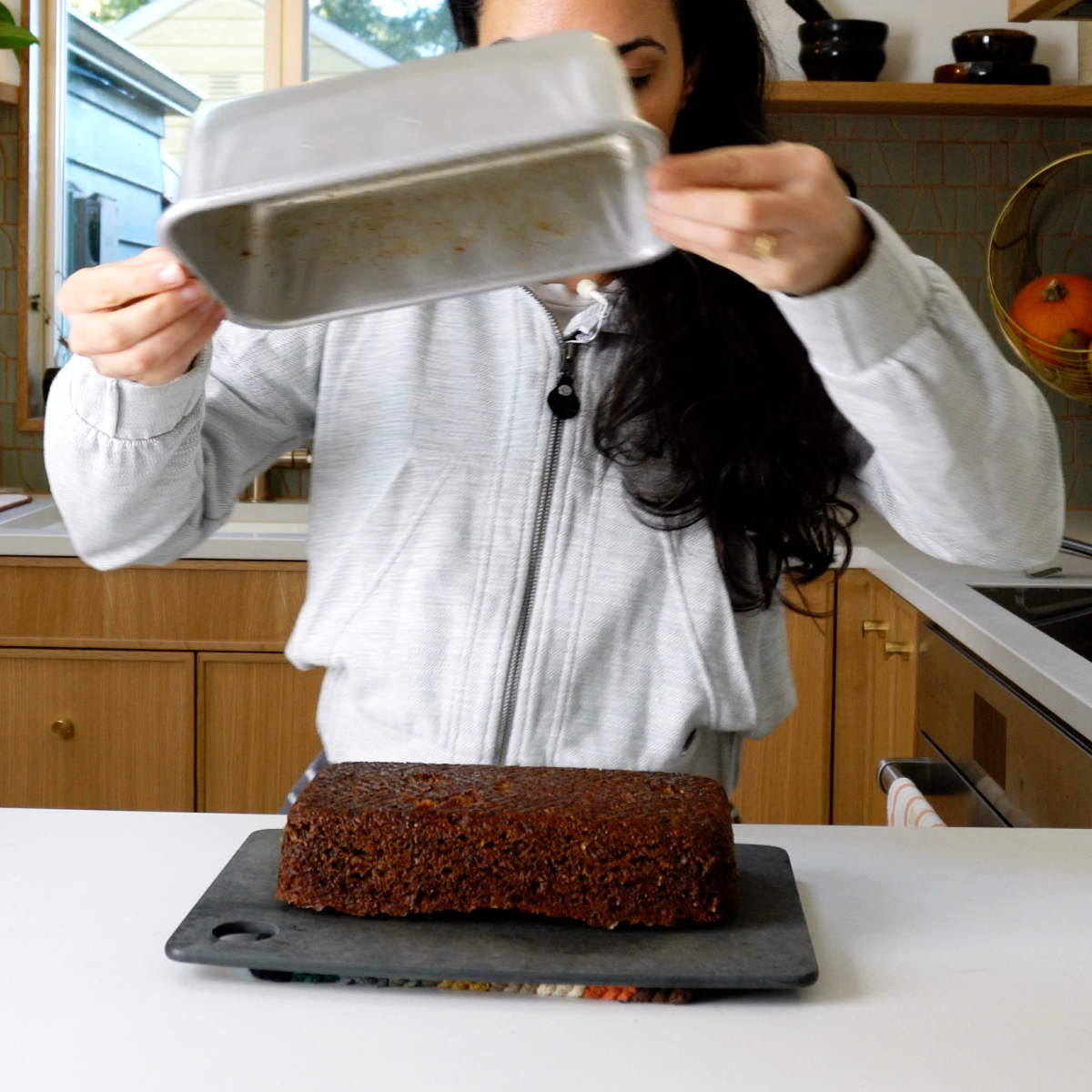 Quickbread being released from a metal loaf pan.