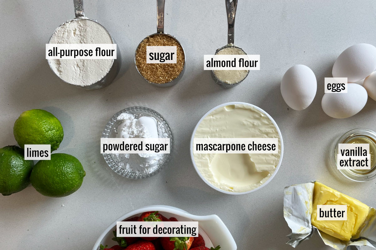 Limes and other labeled baking ingredients on a countertop.