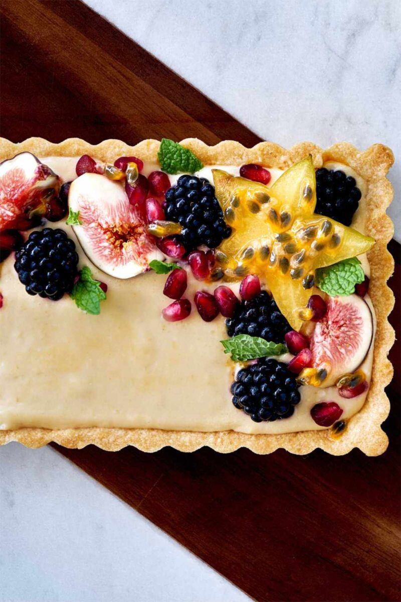 Fruit tart topped with berries and figs.
