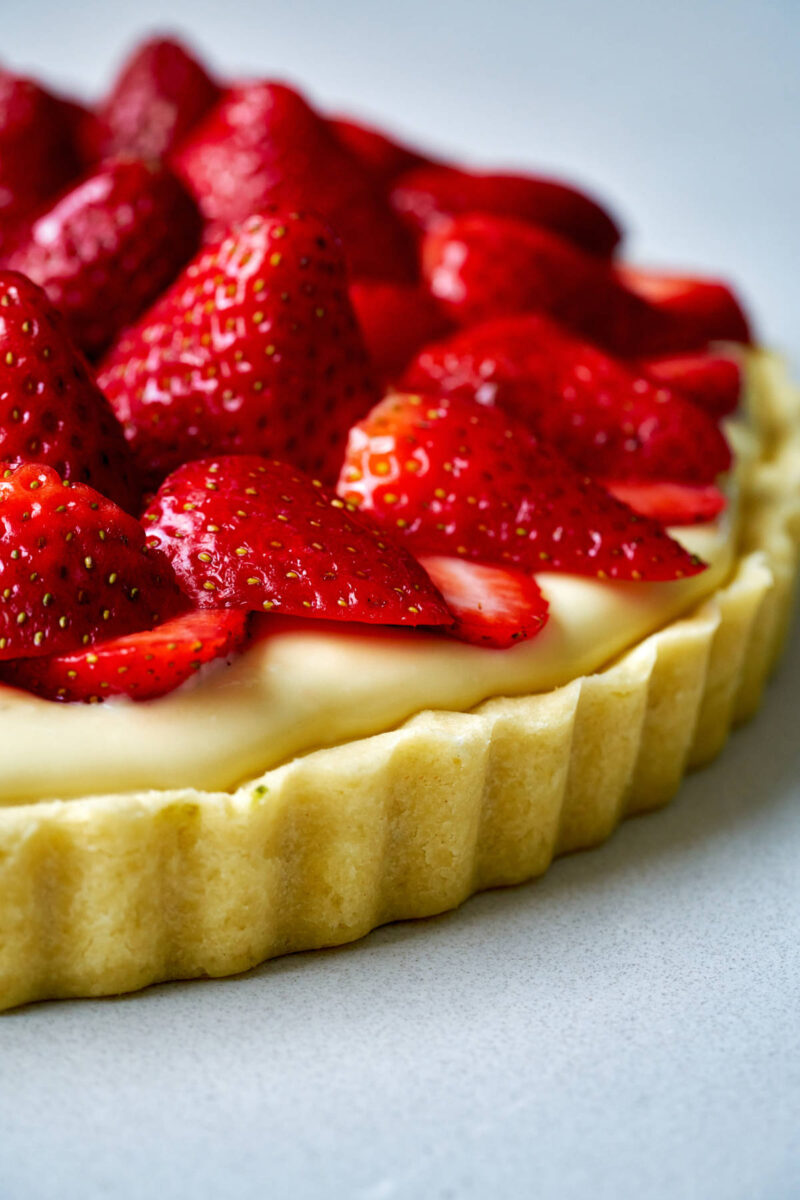 Fruit tart topped with strawberries.