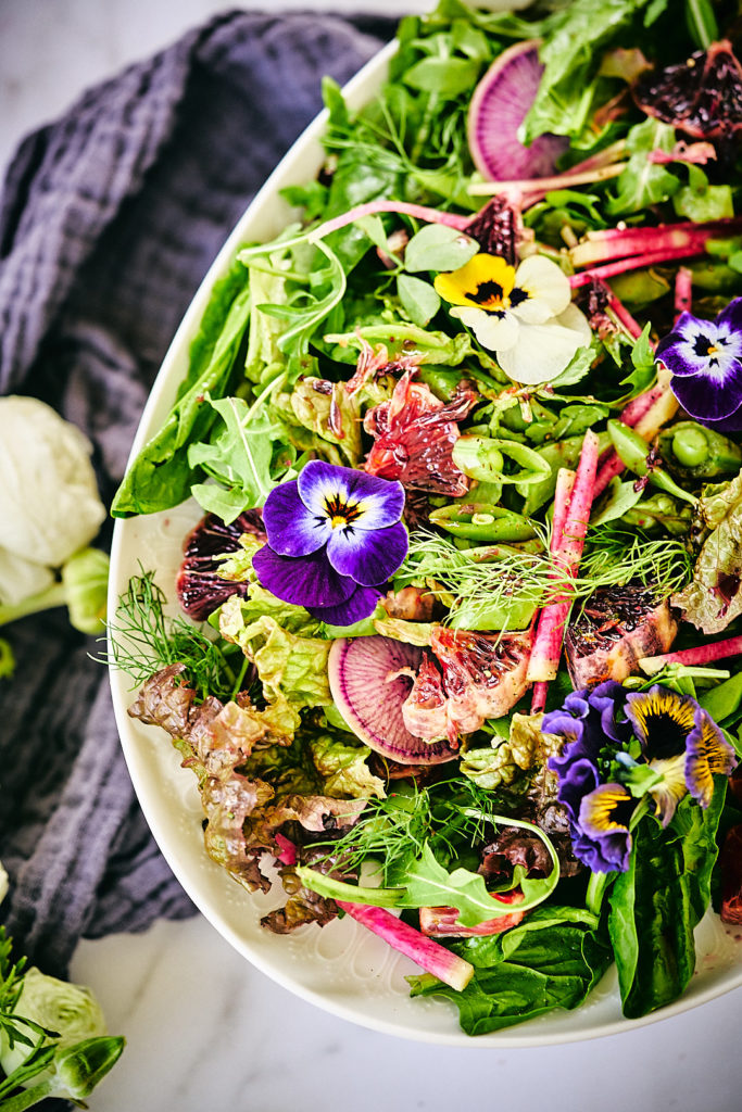 Top view of a salad with flowers.