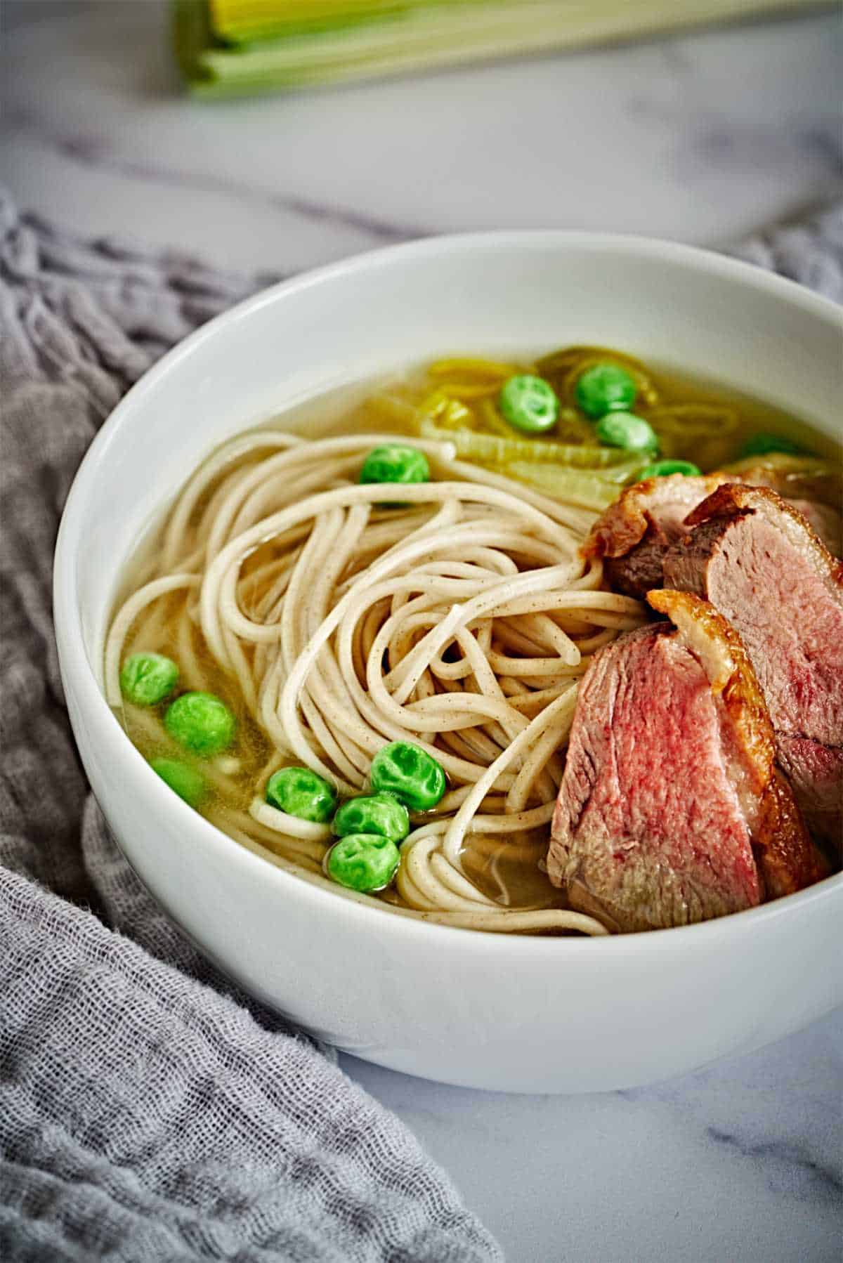 Bowl of noodle soup with duck.