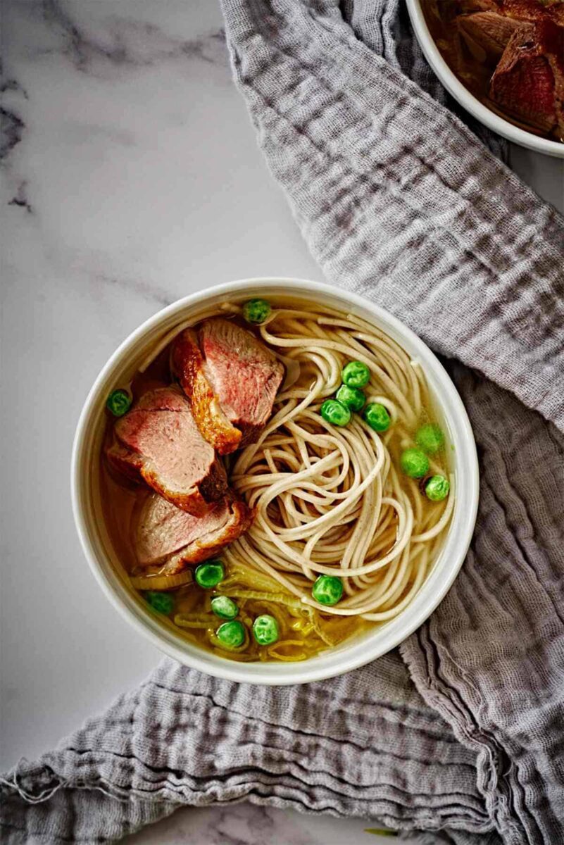 Bowl of noodle soup with duck.