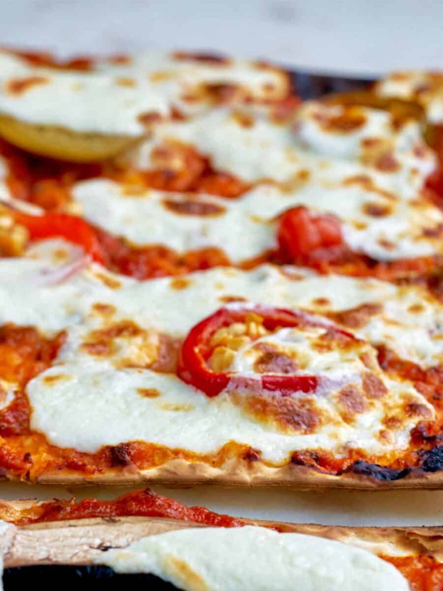 Close up of thin pizza.