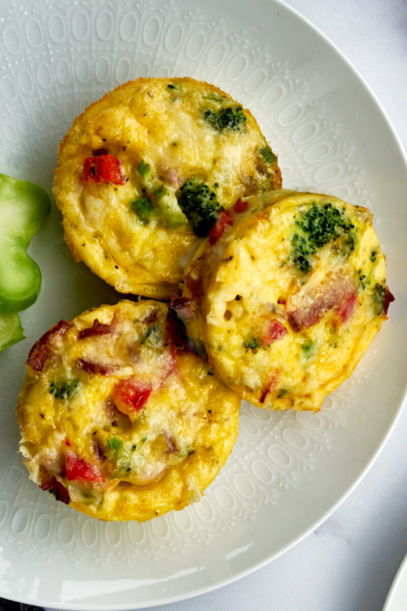 Three egg bites on a white plate.