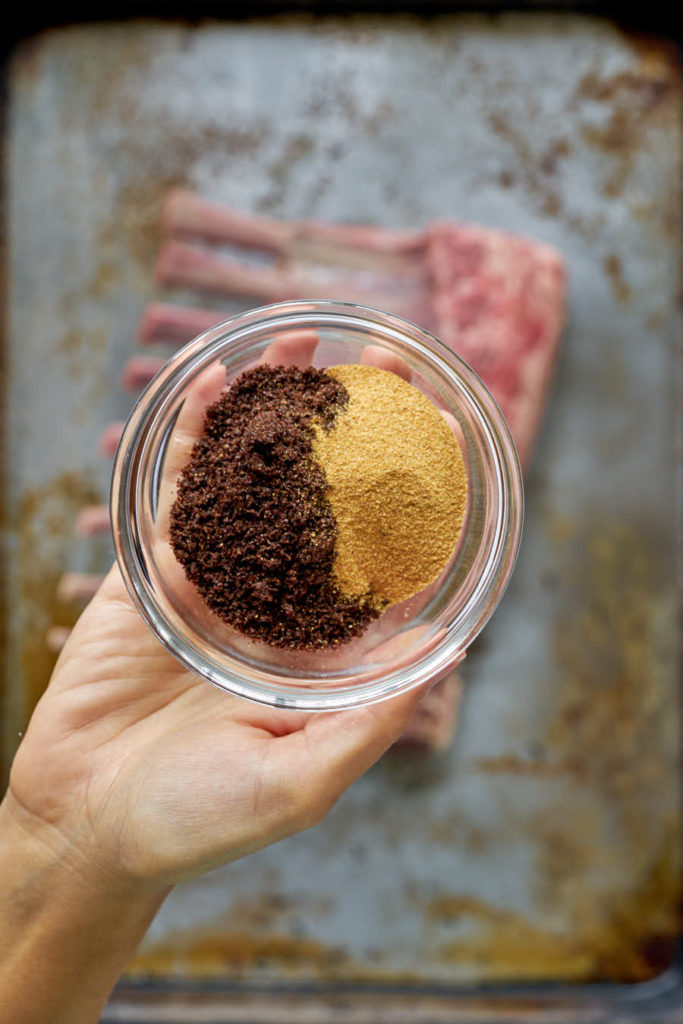 Two spices in a bowl in a hand.