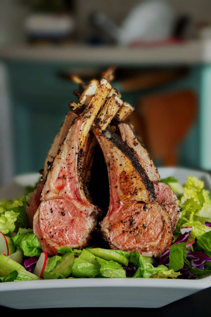 Roasted rack of lamb on a salad.