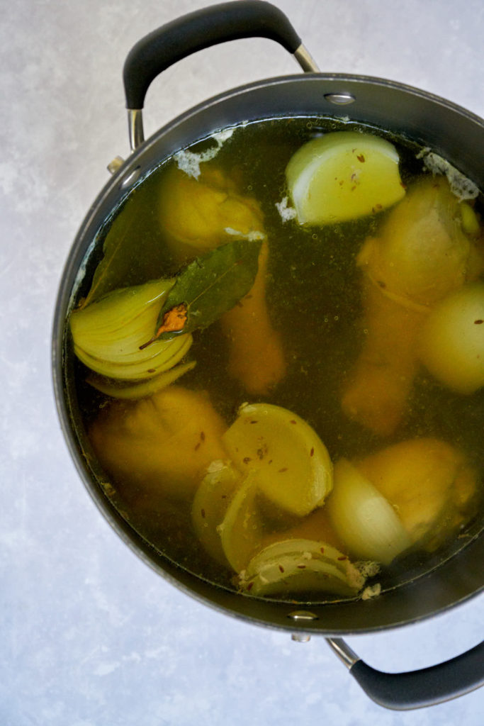 Stock pot with chicken and vegetables.