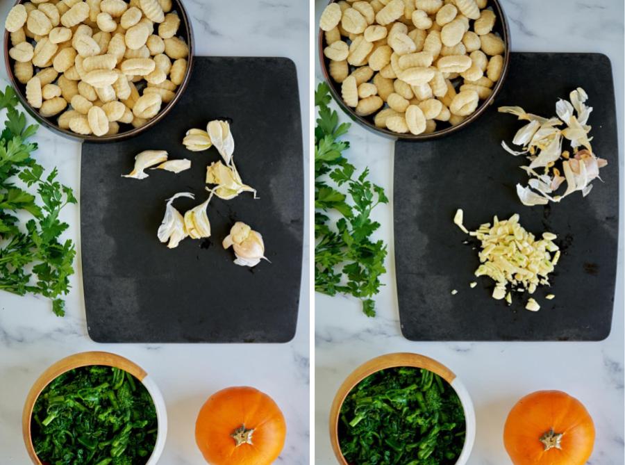 Ingredients on marble counter with garlic on black cutting board.