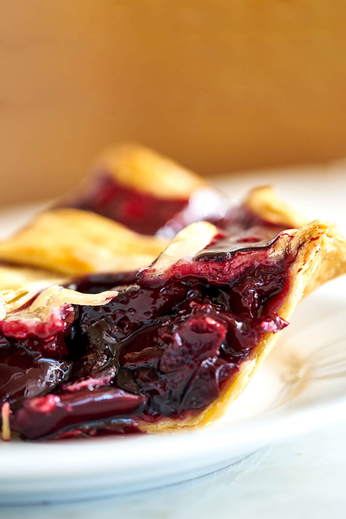 Side view of a slice of cherry pie.