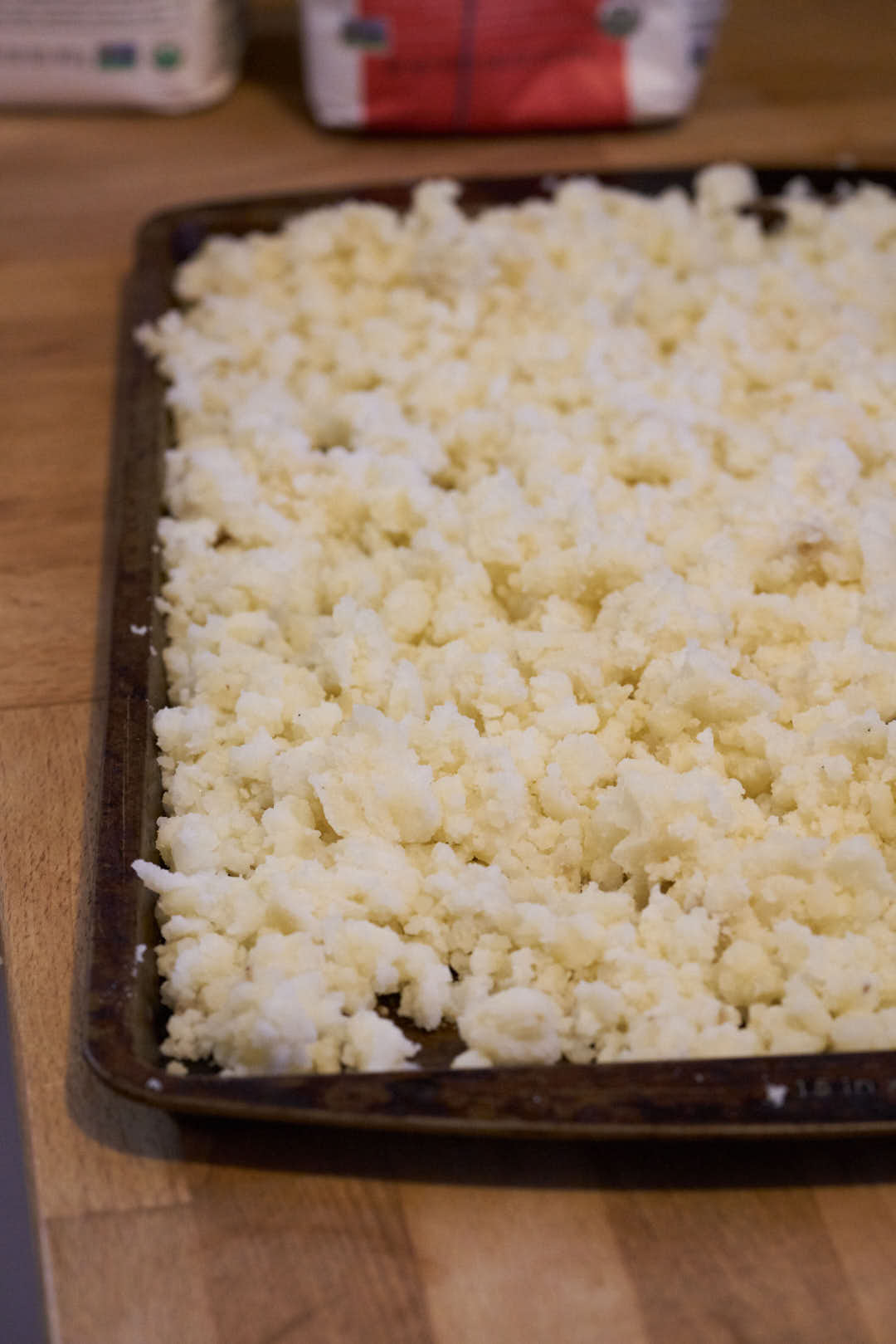 Milled potatoes on a sheet pan.