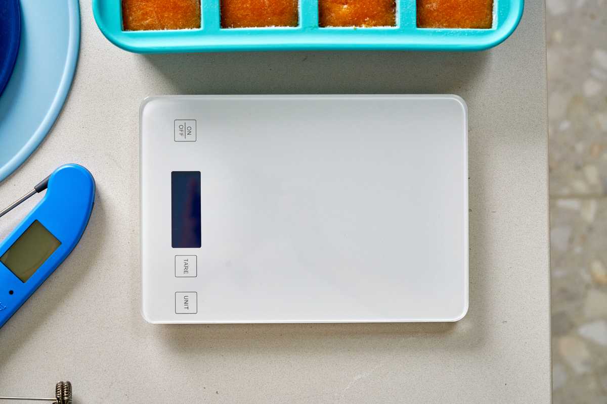 White kitchen scale on a countertop.