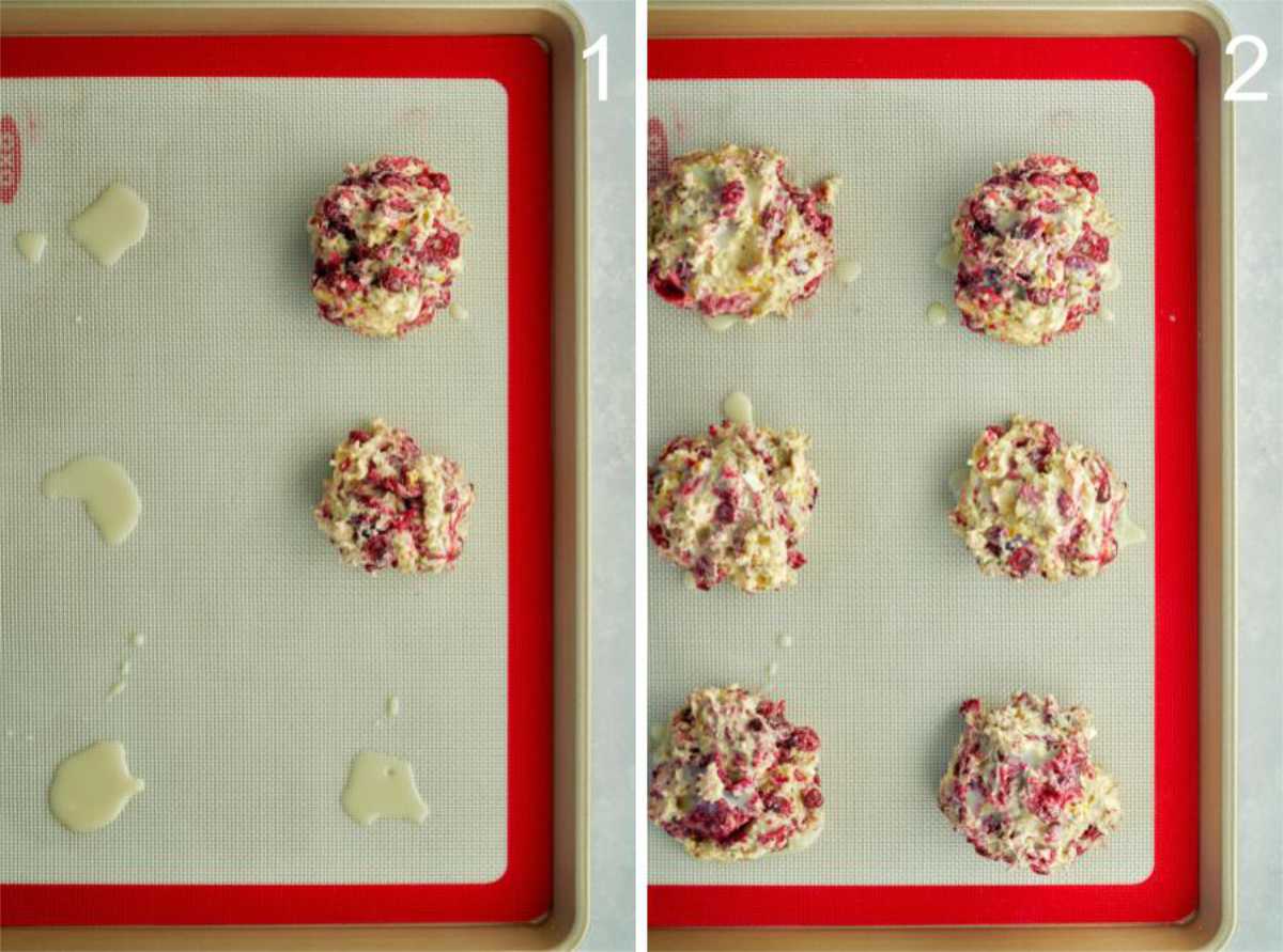 Fruit scones on a baking sheet with a silicone baking mat.