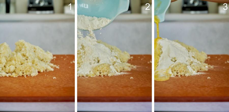 Mixing potato gnocchi dough ingredients together on a cutting board.